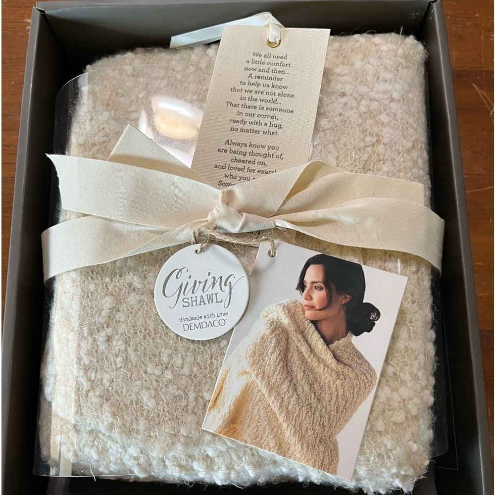 Beautiful cream colored shawl. Brand new with tags.